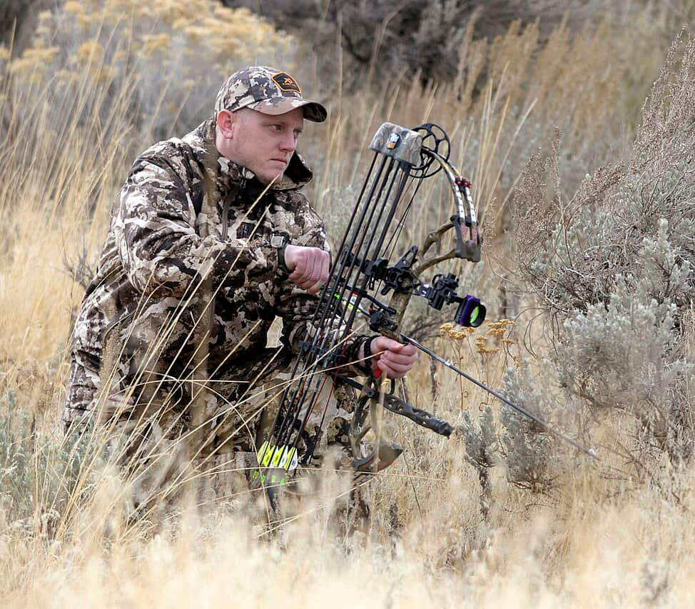 man in bow and arrow